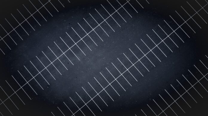 A drone view at night of parking lot lines