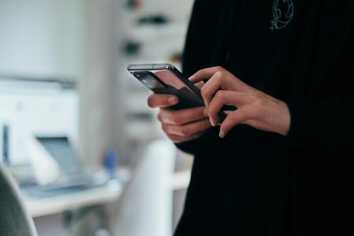 Photo by Jonas Leupe person holding black android smartphone